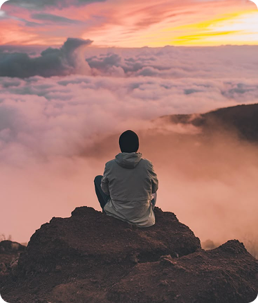 Silhouette of person against sunset sky